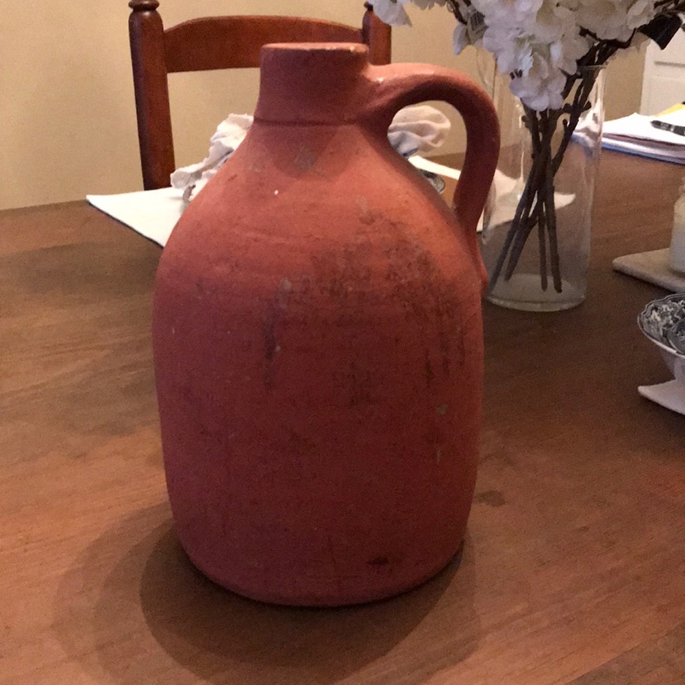 Antique brick colored clay jug
